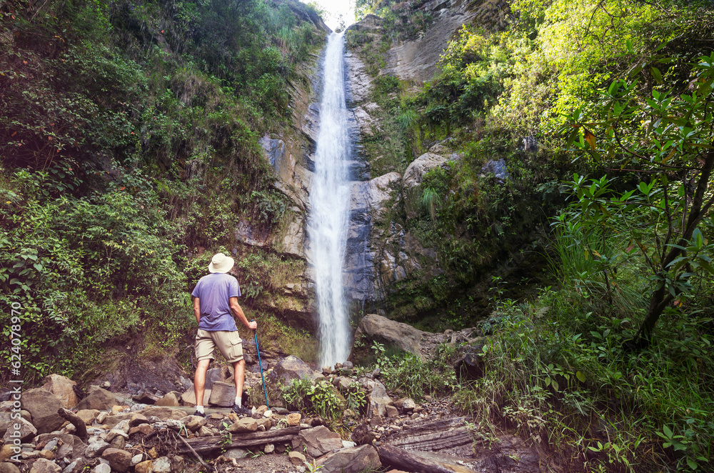 Hiker near waterfall