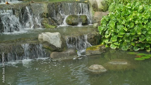 Waterfalls over rocks and ponds
