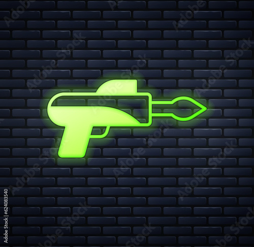 Glowing neon Fishing harpoon icon isolated on brick wall background. Fishery manufacturers for catching fish under water. Diving underwater equipment. Vector