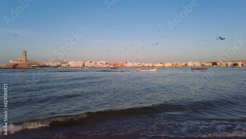 Sur, Oman: Footage of the Sur coastal city by the Arabian sea with the Al-Ayjah Lighthouse and castle not far from Muscat in the Middle east  photo