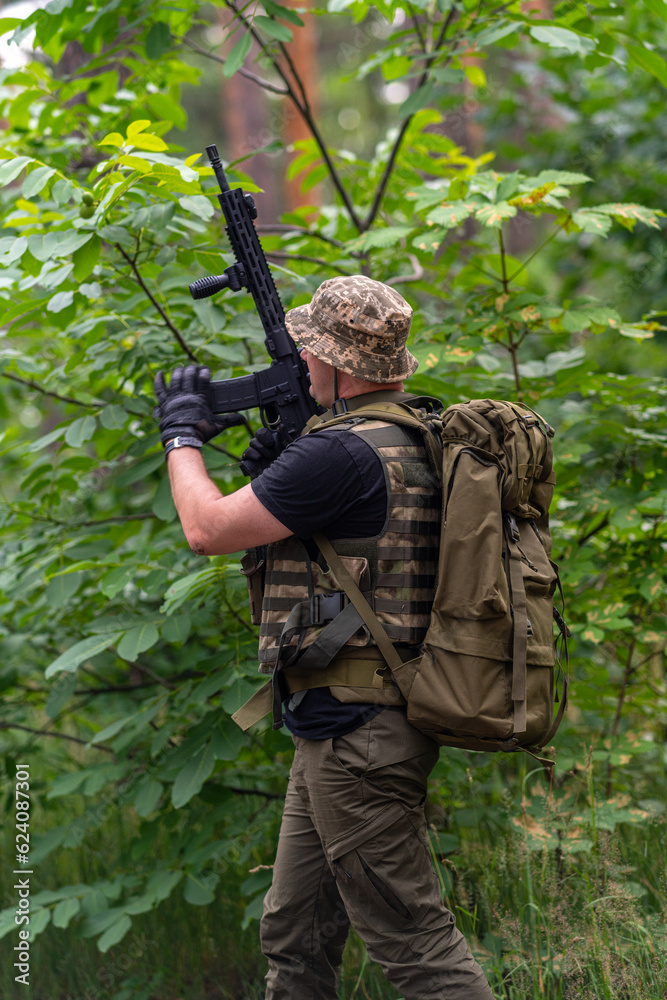 A soldier inserts a magazine with cartridges into a rifle