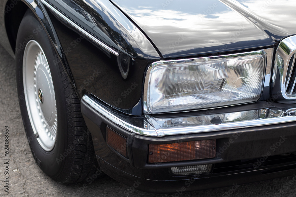 Headlight on a retro car. Close-up.