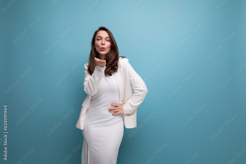 brunette business woman in dress is successful in model posing brunette business woman in dress is successful in model posing