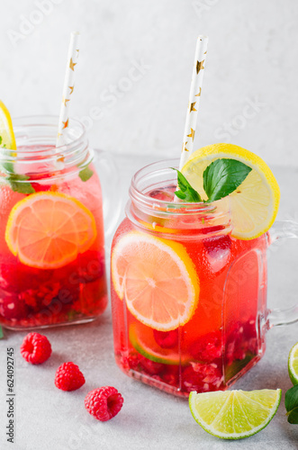 Refreshing Cold Cocktail or Mocktail with Berries and Lime, Raspberry Lemonade