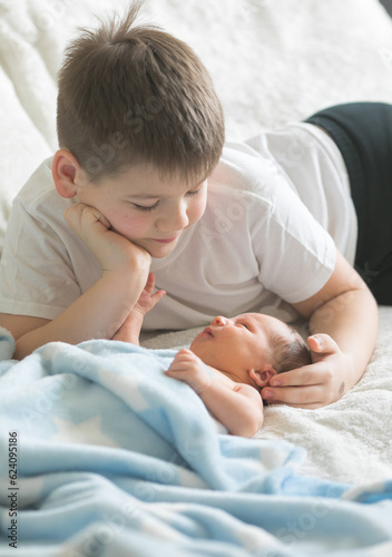 Принти на полотні Big brother with his little newborn brother. love family concept