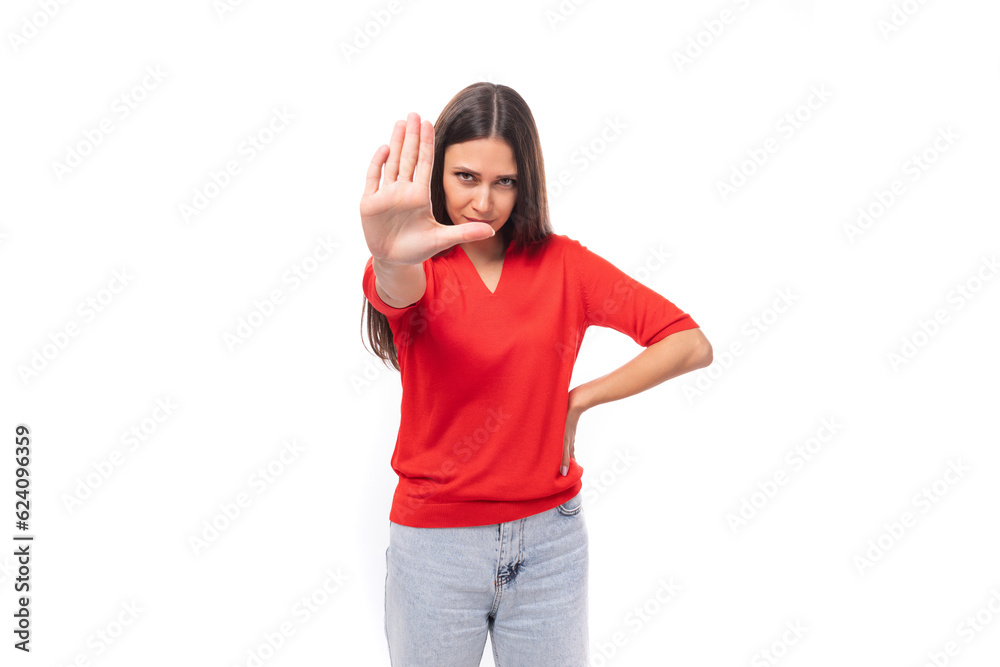 young caucasian female model with black straight hair dressed in a red t-shirt asks to stop young caucasian female model with black straight hair dressed in a red t-shirt asks to stop