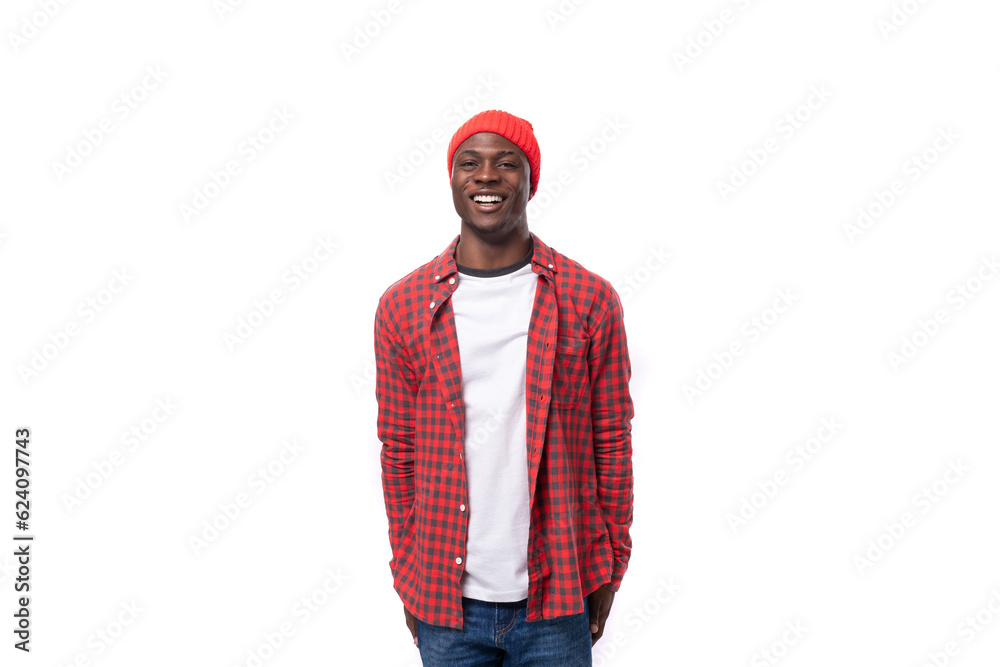 handsome young ethnic african guy in red plaid shirt isolated on white background handsome young ethnic african guy in red plaid shirt isolated on white background