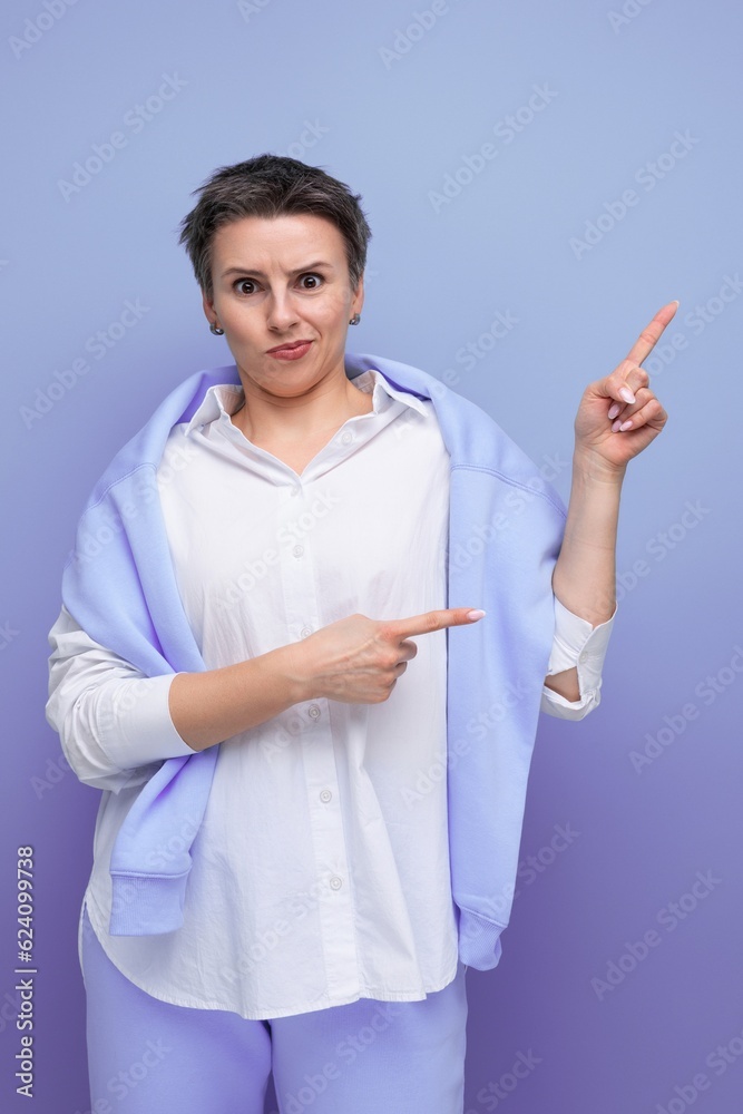 a bright young woman in an informal bow charismatically points her finger at space a bright young woman in an informal bow charismatically points her finger at space