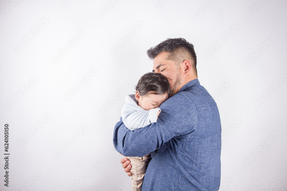 Beautiful photo of dad holding baby on light photo studio background. Family and baby concept. Beautiful photo of dad holding baby on light photo studio background. Family and baby concept.