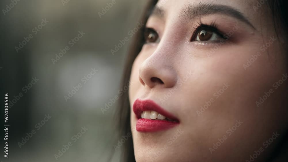 A portrait of a young Asian woman opening her beautiful eyes and looking up to the sky. Close-up, concept of faith and hope. Portrait of a woman with a reflection of rooftops and sky in her eyes A portrait of a young Asian woman opening her beautiful eyes and looking up to the sky. Close-up, concept of faith and hope. Portrait of a woman with a reflection of rooftops and sky in her eyes