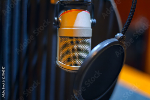 professional microphone with pop killer in a recording studio photo