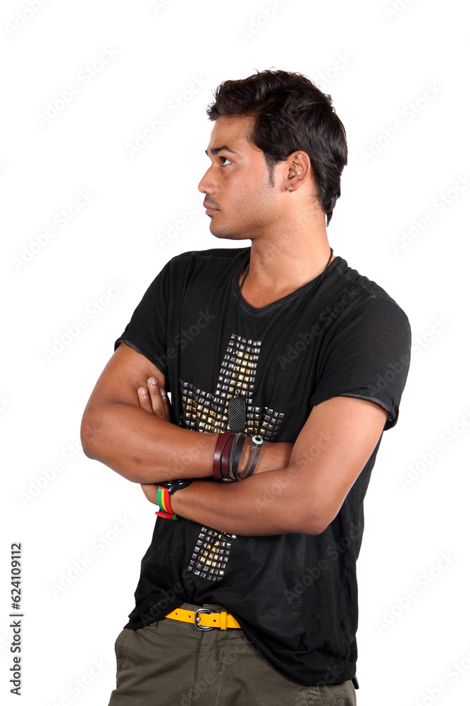 A young handsome Indian guy lost in his thoughts, on white studio background.