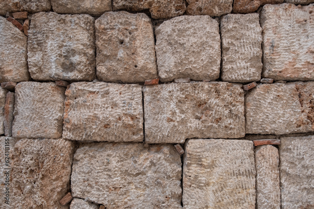 Obraz premium Texture of a stone wall. Old castle stone wall texture background. Stone wall as a background or texture. Part of a stone wall, for background or texture