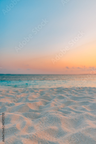 Closeup of sea beach and colorful sunset sky. Panoramic beach landscape. Empty tropical beach and seascape. Orange and golden sunset sky  soft sand  calmness  tranquil relaxing sunlight  summer coast