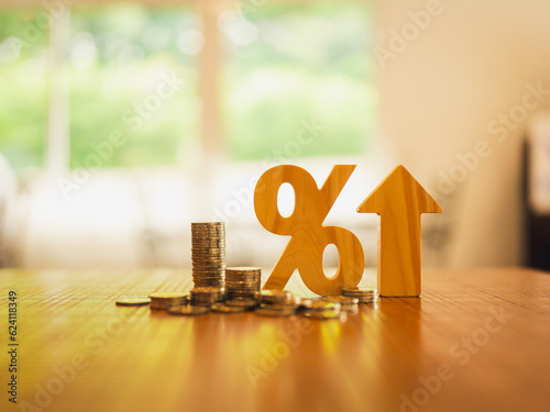 Fotografia Percentage model and Up Arrow symbol with coins stack