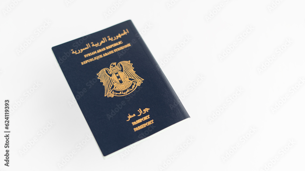 close-up photo of Syrian passport, on white background. close-up photo of Syrian passport, on white background.