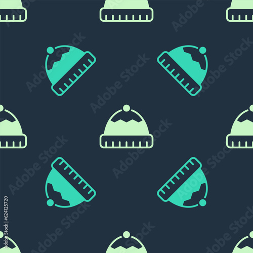 Green and beige Winter hat icon isolated seamless pattern on blue background. Vector