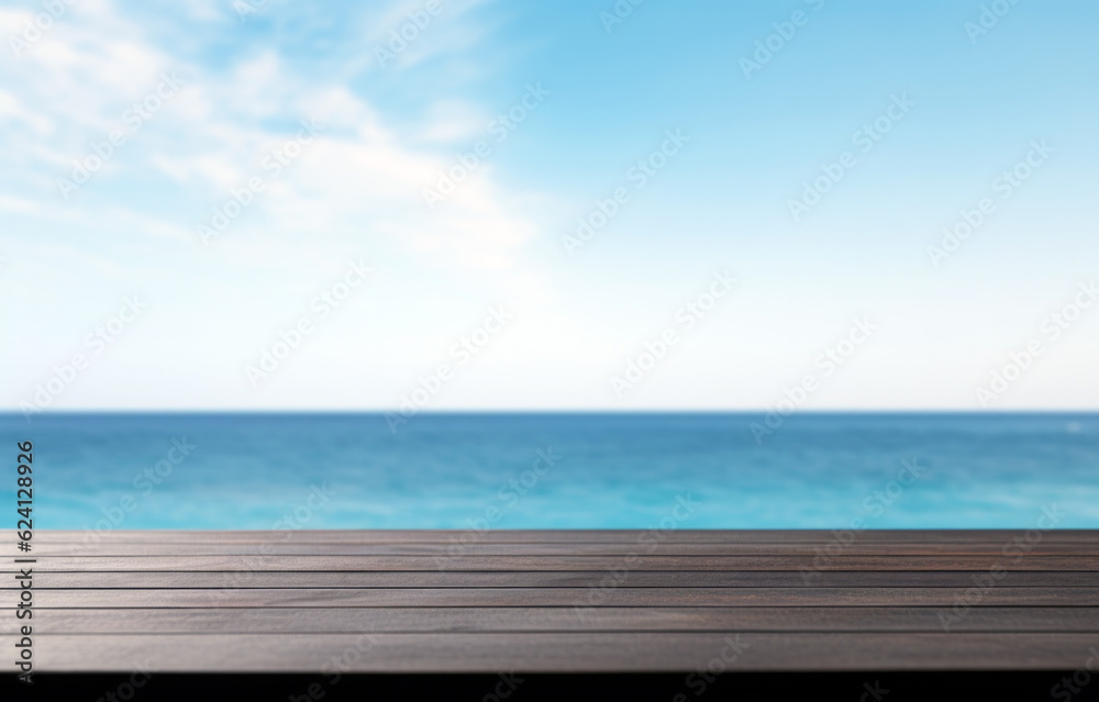 Black wooden table top and blur seascape and blue sky of the background. High quality photo