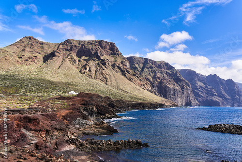 Seascape with a view of a powerful island of rocks. The unexplored part of the island of Tenerife
