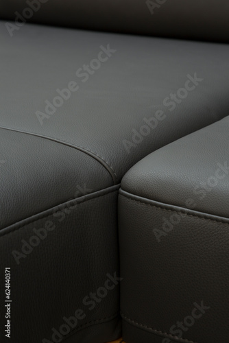 Obraz na płótnie Corner sofa made of leather. Photograph of details in an interesting light w salonie