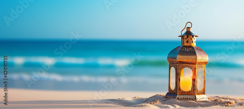 Ramadan lantern in a tropical summer beach. Golden sand beach, ocean against blue sky