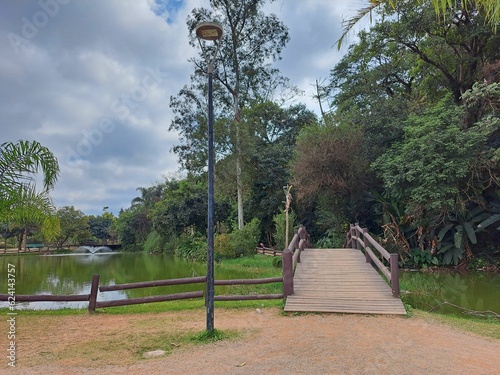 Guarulhos, São Paulo, Brazil - June 30, 2022. View of the two wooden bridges, fountain and lake in Bosque Maya in Guarulhos.