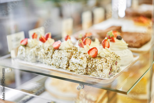 fresh pastries with berries. A variety of fresh pastries in the bakery window. almond croissant is fresh and hot in a cafe next to other types of pastries. The interior of an Italian restaurant.