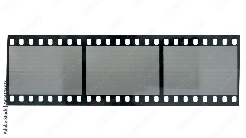 bright light shining over long 35mm filmstrip with three empty frames. bright light shining over long 35mm filmstrip with three empty frames.