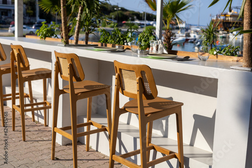 vacant bar chairs at seaside restaurant © aerogondo