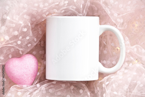 white mug on a pink background with heart and lights. Valentine's day and mother's day mug mock up