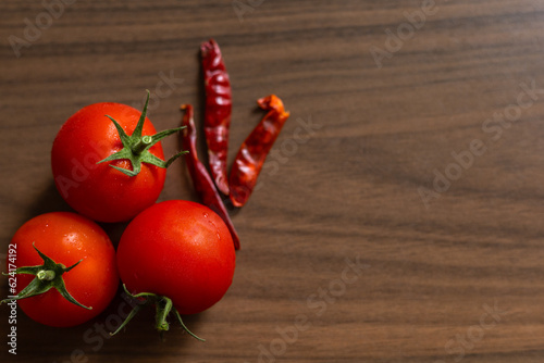 Fresh tomatoes on dark background, harvest tomatoes, top view.  space.