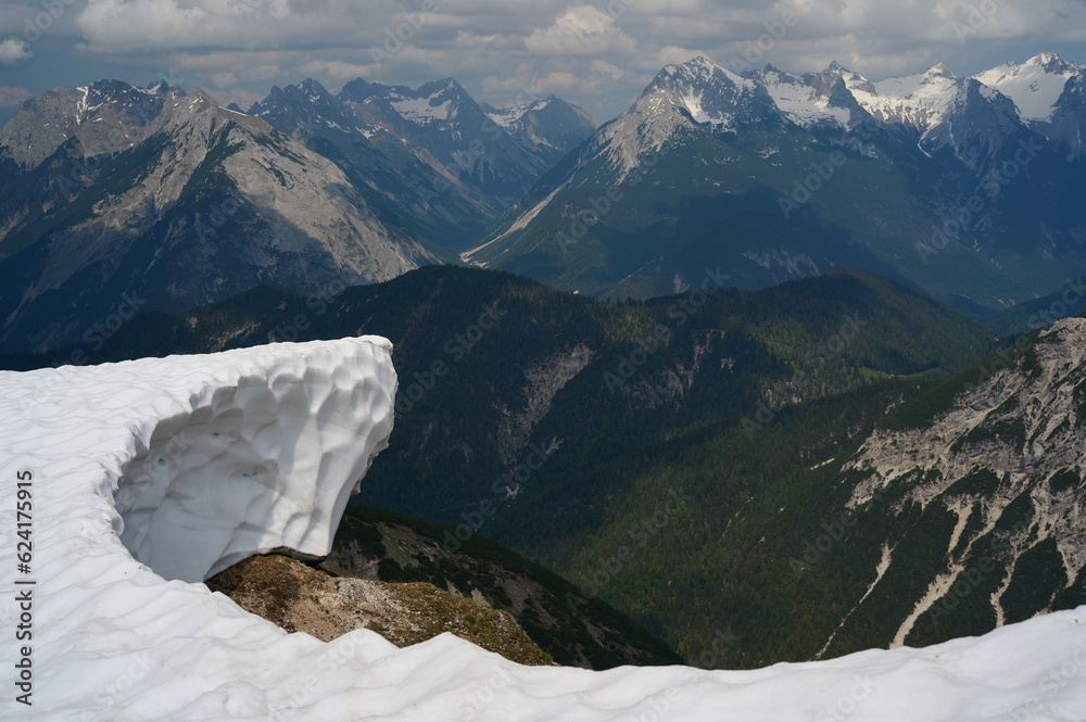 Mountain view in Austrian Alps with a Cornice Melting