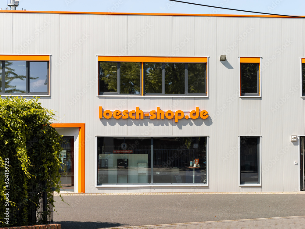 DRESDEN, GERMANY 24. June 2023 logo sign on the building exterior. The shop sells