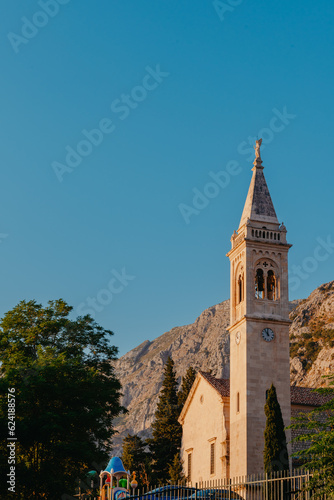 Beautiful Sunset view of the coast of Kotor Bay and St.Eustace's Church in the village Dobrota in Montenegro. Church of St. Eustachius is located in Dobrota , Kotor Montenegro.