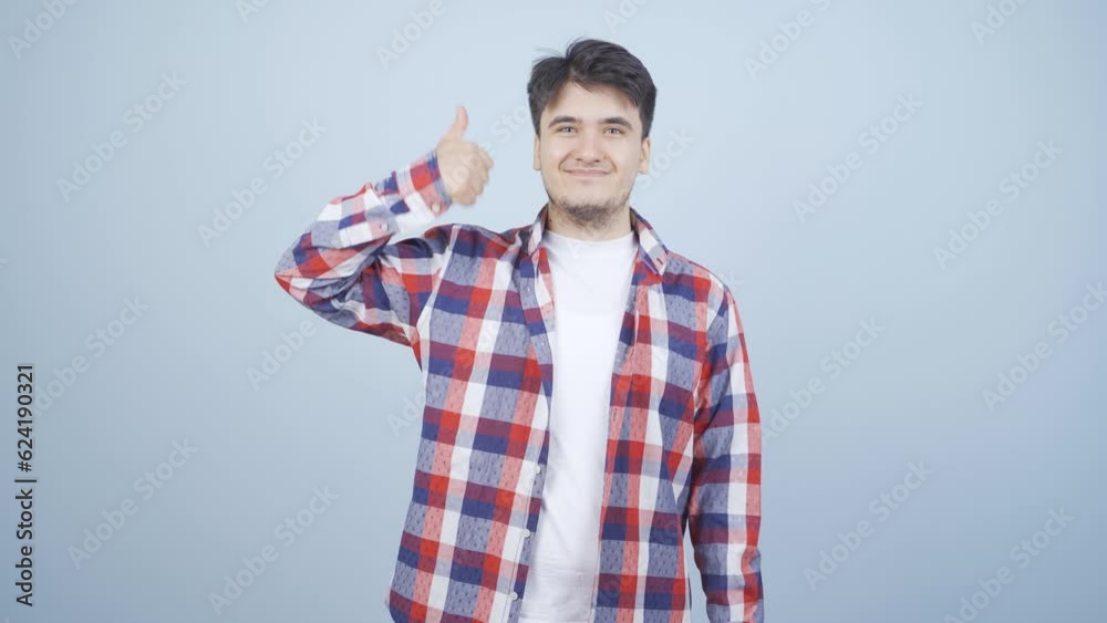 Man making positive gesture at camera. Man making positive gesture at camera.