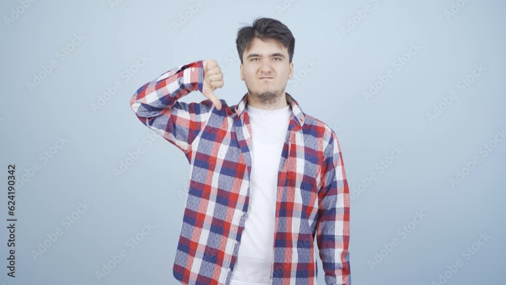 Man looking at camera with a negative expression. Man looking at camera with a negative expression.