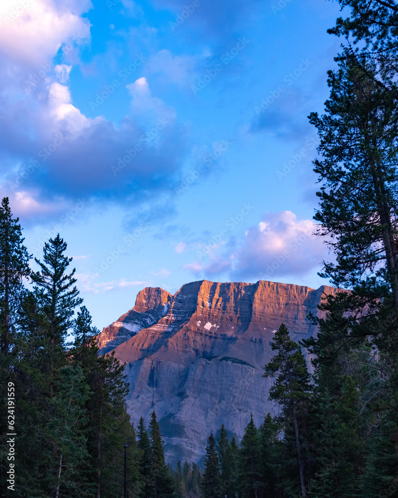 Sunset sky over Mount Rundle in Banff National Park during summer time ...