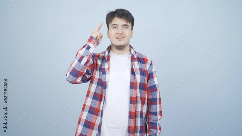 Thoughtful man towards camera comes up with an idea. Thoughtful man towards camera comes up with an idea.