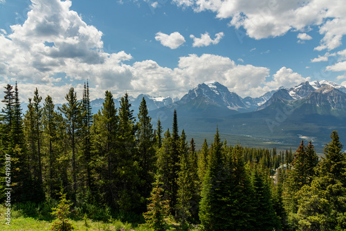Incredible summer time mountain views in Banff National Park with vast landscape surrounding the national park area. Snow capped mountains near Lake Louise. 