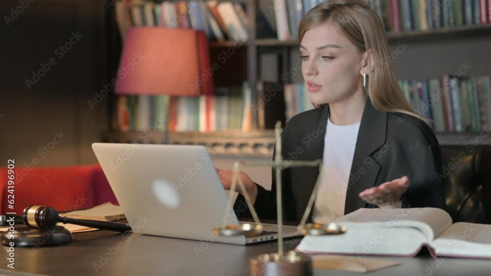 Female Lawyer Doing Video Chat in Office Female Lawyer Doing Video Chat in Office