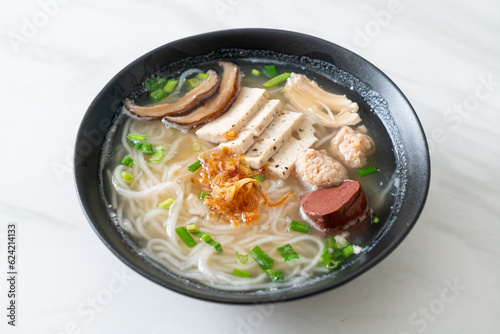 Vietnamese Rice Noodles Soup with Vietnamese Sausage served vegetables and crispy onion