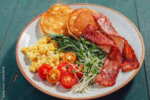 Breakfast Pancakes with Bacon and Scrambled Eggs photo