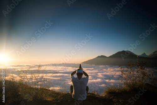 Bali Balinese or Java Javanese Hindu Religious Island Hinduism Prayer Outdoor Nature on top of Mountain during Sunrise
