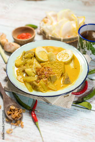 Lontong Sayur Padang, Vegetable Curry with Rice Pressed Cake, Served with Boiled Egg