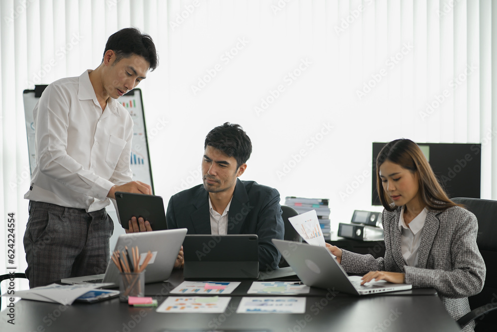 Asia business meeting consultations of business people in the company's meeting room. Asia business meeting consultations of business people in the company's meeting room.