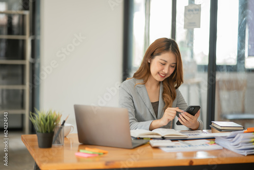 Asian business woman looking at financial documents
