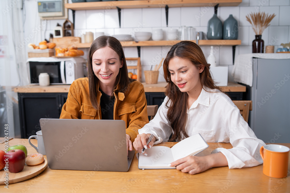 Asian businesswoman using laptop or tablet to work, discuss and discuss during company holidays. Asian businesswoman using laptop or tablet to work, discuss and discuss during company holidays.