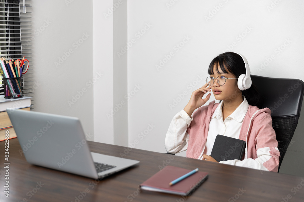 Student girl happy studying online, back to school concept. Young woman student busy study make notes in notebook and using laptop concentrated online training course technology education. Student girl happy studying online, back to school concept. Young woman student busy study make notes in notebook and using laptop concentrated online training course technology education.