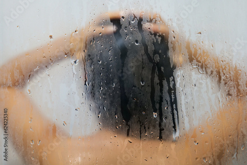 Young Brown Woman Washes her Hair in the Shower © Alexandre