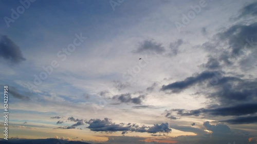 Silhouette Of Airplane Flying Across Sky And Out Of Frame During Stunning Beautiful Sunset. photo